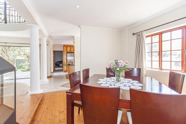 Dinning room with kitchen in the background