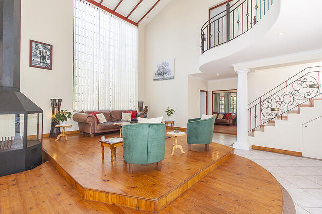 Double Volume lounge open plan with TV Room