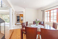 Dinning room with kitchen in the background