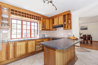 Kitchen facing stove and dinning room