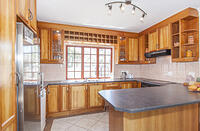 Kitchen including fridge and dishwasher